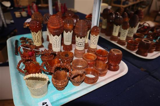 A group of 19th century coquilla nut and vegetable ivory engine turned containers, stands, miniature baskets, napkin rings and jeweller